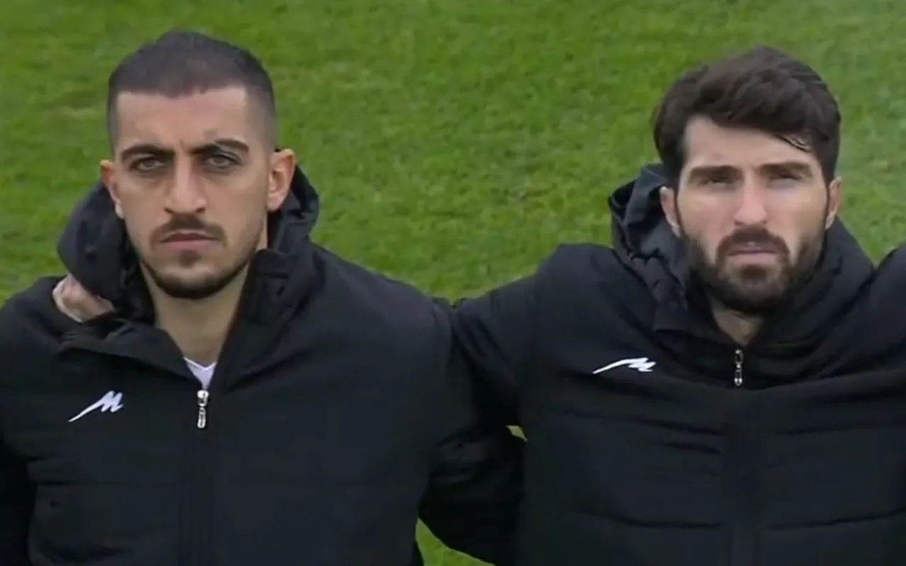 ifmat - Iran players cover badges to protest against repression of women